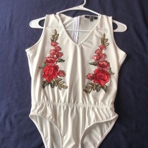 White no sleeve rose bodysuit